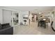Open-concept living area with tile flooring and sliding glass doors to the patio at 7740 Bracken Dr, Port Richey, FL 34668