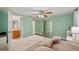 Spacious main bedroom with private bath, walk-in closet, ceiling fan, and neutral color palette at 7740 Bracken Dr, Port Richey, FL 34668