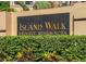 Elegant community sign surrounded by lush greenery at Island Walk Private Residences at 812 Normandy Trace Rd, Tampa, FL 33602