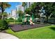 A colorful playground set in a green area offers a fun space for children to play at 812 Normandy Trace Rd, Tampa, FL 33602