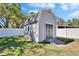 The backyard has a large shed on a manicured lawn with a privacy fence at 8942 Aberdeen Creek Cir, Riverview, FL 33569