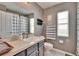 This is a secondary bathroom with gray walls, a window, and a shower-tub combo at 8942 Aberdeen Creek Cir, Riverview, FL 33569