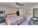 This is a secondary bedroom with a queen bed and neutral-toned walls and carpet at 8942 Aberdeen Creek Cir, Riverview, FL 33569