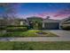 Charming single-story home featuring manicured landscaping, a two-car garage, and a welcoming front entrance at 8942 Aberdeen Creek Cir, Riverview, FL 33569