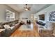 Spacious living room with vaulted ceilings and modern decor and expansive seating at 8942 Aberdeen Creek Cir, Riverview, FL 33569