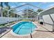 Beautiful screened-in pool with lush landscaping, brick pavers and a spacious backyard at 8942 Aberdeen Creek Cir, Riverview, FL 33569