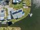 Areal view of a waterfront home featuring solar panels and a dock on a sunny day at 9017 Petal Ct, Hudson, FL 34667