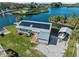 Aerial view of the home featuring solar panels and water access at 9017 Petal Ct, Hudson, FL 34667