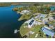 Waterfront home with dock, lush landscaping, and stunning views of the adjacent river at 9017 Petal Ct, Hudson, FL 34667