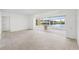 Spacious living room with large windows offering water views at 9017 Petal Ct, Hudson, FL 34667