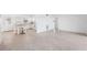 Open living space featuring a modern kitchen and ample room for entertaining at 9017 Petal Ct, Hudson, FL 34667