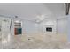 A large basement with a fireplace, wet bar, and access to an outdoor staircase at 902 Marco Ne Dr, St Petersburg, FL 33702