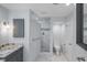 Bathroom featuring granite countertops, a walk-in shower, and modern fixtures at 902 Marco Ne Dr, St Petersburg, FL 33702
