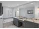 Elegant primary bathroom with double sinks, granite countertops, and a soaking tub at 902 Marco Ne Dr, St Petersburg, FL 33702