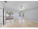 Spacious bedroom with tile floors, a ceiling fan, and sliding glass doors to the lanai at 902 Marco Ne Dr, St Petersburg, FL 33702