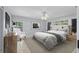Bedroom with contemporary decor, including tufted headboard and modern artwork at 902 Marco Ne Dr, St Petersburg, FL 33702