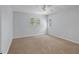 Bright bedroom featuring neutral carpet and shuttered windows at 902 Marco Ne Dr, St Petersburg, FL 33702