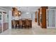 Open kitchen with stainless steel appliances, center island, and travertine flooring at 902 Marco Ne Dr, St Petersburg, FL 33702