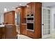 Spacious kitchen with stainless steel appliances, custom cabinets, and stone countertops at 902 Marco Ne Dr, St Petersburg, FL 33702