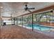 Screened lanai featuring a covered patio, beautiful pavers, and a sparkling pool at 902 Marco Ne Dr, St Petersburg, FL 33702