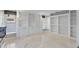 Bright living room boasting built-in bookshelves, custom cabinets, and a window seat at 902 Marco Ne Dr, St Petersburg, FL 33702