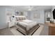 Staged primary bedroom with neutral decor, plantation shutters, and an ensuite bathroom at 902 Marco Ne Dr, St Petersburg, FL 33702