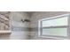 Stylish bathroom shower with tile surround, stone accents and rainfall shower head at 902 Marco Ne Dr, St Petersburg, FL 33702