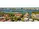 Beautiful aerial view showcasing waterfront condo community with boat access and surrounding lush greenery at 9433 Harbor Greens Way # 405, Seminole, FL 33776