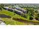 Scenic aerial view highlighting condo buildings, ponds, and landscaped grounds in a serene setting at 9433 Harbor Greens Way # 405, Seminole, FL 33776