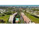 Scenic aerial shot of the condo buildings, showing well-maintained grounds and the nearby waterway at 9433 Harbor Greens Way # 405, Seminole, FL 33776