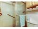 Bathroom showcasing a walk-in shower with grab bar, toilet, and convenient built-in shelving at 9433 Harbor Greens Way # 405, Seminole, FL 33776
