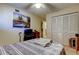 Bedroom featuring a ceiling fan, and large closet with louvered doors offering plenty of storage space at 9433 Harbor Greens Way # 405, Seminole, FL 33776