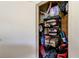 Storage closet with shelving, containing luggage and various household items at 9433 Harbor Greens Way # 405, Seminole, FL 33776