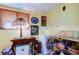 Cozy dining area featuring warm lighting, storage shelves, and a small freezer for convenient food preservation at 9433 Harbor Greens Way # 405, Seminole, FL 33776