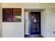 Close-up of the front door with peephole, security screen, and visible unit number at 9433 Harbor Greens Way # 405, Seminole, FL 33776
