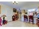 Cozy dining area with a breakfast bar, tile flooring, and a view into the kitchen space at 9433 Harbor Greens Way # 405, Seminole, FL 33776