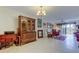 Inviting living room with tile floors, elegant furnishings, and sliding glass doors to the balcony at 9433 Harbor Greens Way # 405, Seminole, FL 33776