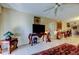 Elegant living room featuring tile flooring, ceiling fan, and an array of ornate furniture at 9433 Harbor Greens Way # 405, Seminole, FL 33776