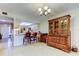 Open-concept area featuring a breakfast bar, tile flooring, and seamless access to the living space at 9433 Harbor Greens Way # 405, Seminole, FL 33776