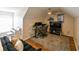 Upstairs bonus room is carpeted and has a ceiling fan and piano at 9730 Lake Chase Island Way # 9730, Tampa, FL 33626