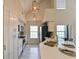 Modern kitchen with white cabinets, stainless steel appliances, and a breakfast bar island at 9730 Lake Chase Island Way # 9730, Tampa, FL 33626