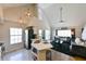 Bright kitchen featuring pendant lighting, stainless steel appliances, and an island with seating at 9730 Lake Chase Island Way # 9730, Tampa, FL 33626