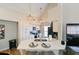 Well-lit kitchen with an island featuring a breakfast bar and modern pendant lighting at 9730 Lake Chase Island Way # 9730, Tampa, FL 33626