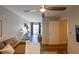 Inviting living room with hardwood floors, neutral walls, and a ceiling fan at 9730 Lake Chase Island Way # 9730, Tampa, FL 33626