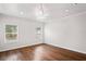 Bright, spacious bedroom features hardwood floors, ample lighting, and two windows at 1001 Newton S Ave, St Petersburg, FL 33705