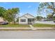 Charming home featuring a clean exterior with a well-manicured lawn and inviting front porch at 1001 Newton S Ave, St Petersburg, FL 33705