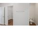 Hallway featuring a towel rack, a view into the walk-in closet, and a toilet at 1001 Newton S Ave, St Petersburg, FL 33705