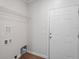 A utilitarian laundry area featuring a wire shelf and a door to the outside at 1001 Newton S Ave, St Petersburg, FL 33705