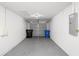Spacious two car garage with concrete floor, overhead lighting, and an automatic door at 1225 Harvest Home Ct, Ruskin, FL 33570