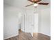 Bedroom showcasing vinyl plank flooring, a ceiling fan, and an ensuite bathroom at 1225 Harvest Home Ct, Ruskin, FL 33570